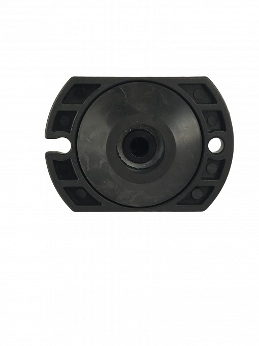 a black, cylindrical object with a hole in the center. It is a BC-0712 Master Cylinder Cap Adapter, which is a part for Chevrolet vehicles.