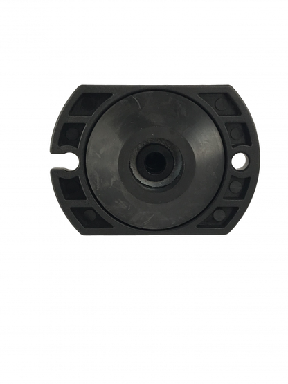 a black, cylindrical object with a hole in the center. It is a BC-0712 Master Cylinder Cap Adapter, which is a part for Chevrolet vehicles.