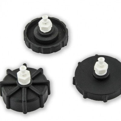 This image displays three master cylinder screw cap adapters, designed for GM and some Nissan models. Each adapter is black with a white plastic fitting, numbered for identification, and engineered for low-pressure use at 15-17 psi.